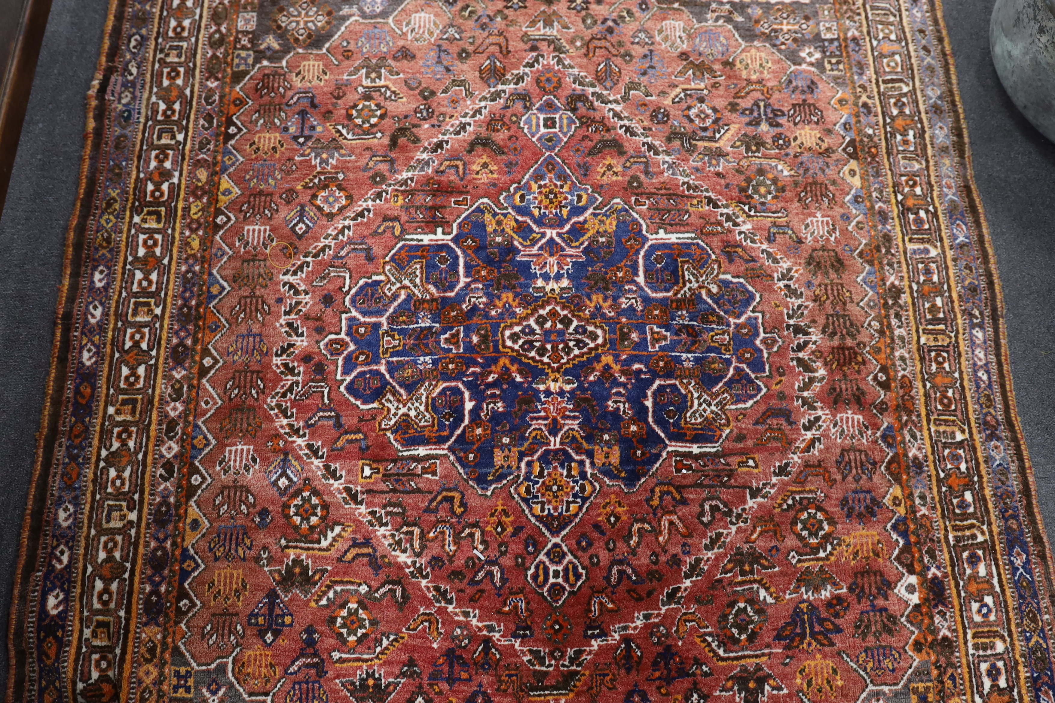 A North West Persian red ground rug, 214 x 156cm